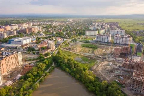 Top view of urban developing city landscape with tall apartment buildings and Stock Photos