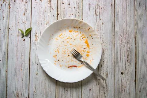 Top view of used empty plate on a background Stock Photos