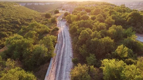 Top view of the valley with cliffs and forest. the medieval houses. sunset Stock Footage 125354896