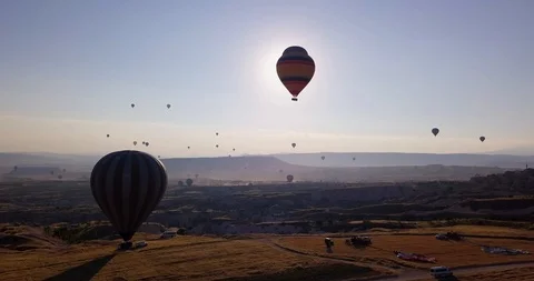 Top view of valley with soaring balloons and preparation of balloons for launch Video stock 104861168
