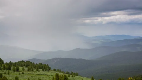 Top view of the valley, where the sun replaces the rain, timelapse Stock Footage 175393514