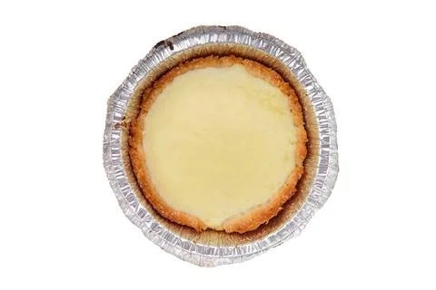 Top view of vanilla cake in a baking foil dish isolated on white Foto stock