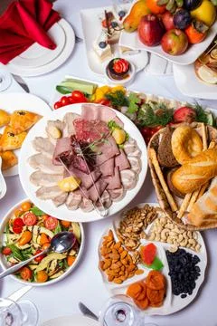 Top view of a variety of buffet snacks at the hotel. cold cuts, assorted chee Stock Photos