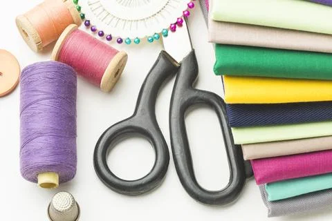 Top view variety fabrics with thread scissors Stock Photos