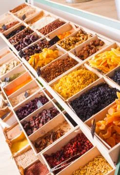 Top view of various dry fruit, raisins and nuts at the shop Stock Photos
