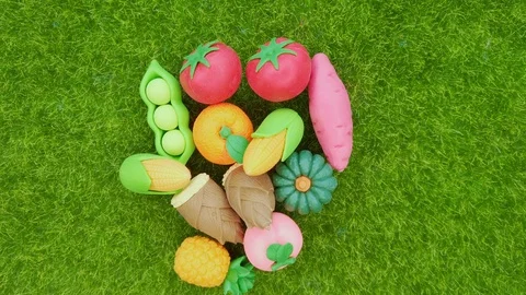 Top view of various rubber miniature colorful vegetables and fruits rotates. Video stock 119159944
