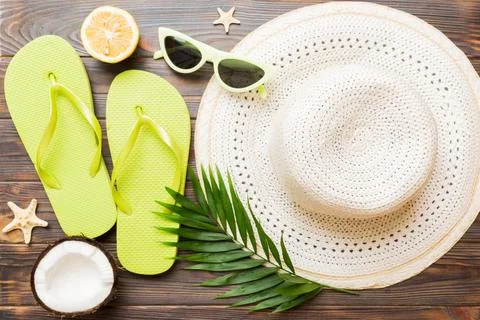 Top view of various seashells placed near colorful fruit and stylish summer.. Stock Photos