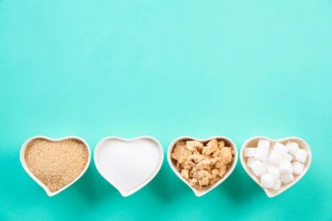 Top view of various types of sugar. Cube sugar, raw sugar brown sugar and gra Stock Photos