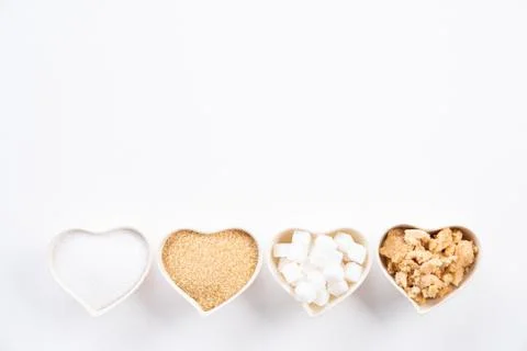 Top view of various types of sugar. Cube sugar, raw sugar brown sugar and gra Stock Photos