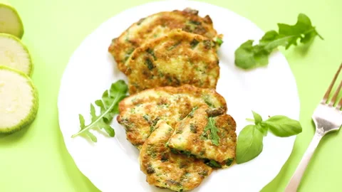 Top view of vegetable pancakes made from zucchini with green onions Stock Footage 311018026