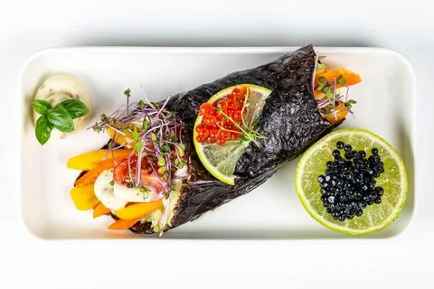 Top view, vegetable roll with red and black caviar Stock Photos