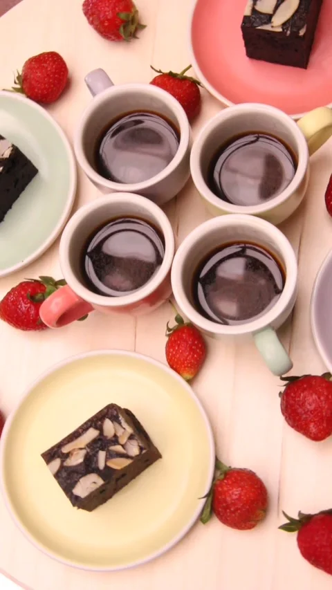 Top View Vertical Rotating Dessert Table with Espresso, Brownies, Strawberries Stock Footage 329403244