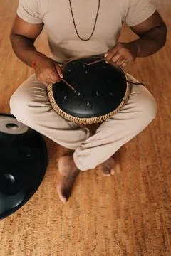 Top view vertical shot of unrecognizable spiritual African man in trance sitting Stock Photos