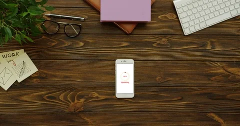 Top view on the vertical smartphone with white screen on which circle with Video stock 95097271