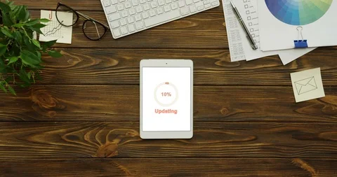 Top view on the vertical tablet computer with white screen on which circle icon Stock Footage 95101707