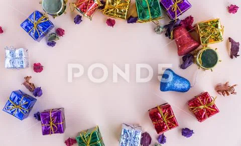 Top view vibrant sparkle gift boxes on soft pink background with copy space Stock Photos