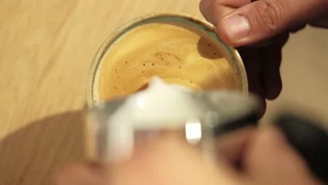 Top view video of barista making latte art in cafe Stock Footage 222172039