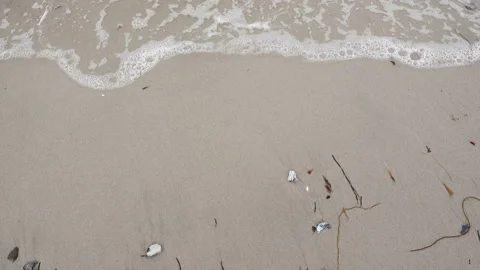 Top view video of waves on white sand at sea in Germany Stock Footage 134339038