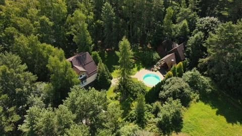 Top view of villa with pool in the forest Stock Footage 141825122