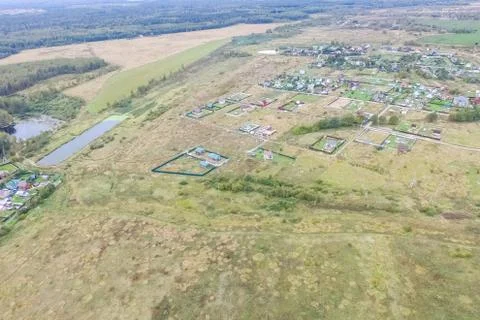 Top view of the village, fields and forests near the village. Stock Photos