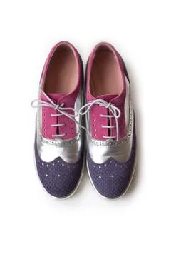 Top view of violet, silver and pink women oxford shoes, isolated on white bac Foto stock