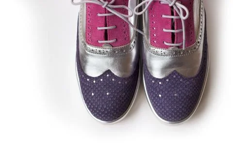 Top view of violet, silver and pink women oxford shoes, isolated on white bac Foto stock