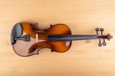 Top view of the violin and the string lying on it. Stock Photos
