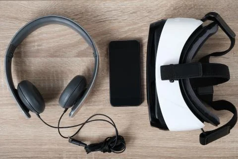 Top view VR virtual reality glasses, headphones and  smart phone Stock Photos