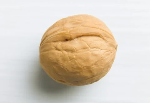 Top view of a walnut in close-up on a white background. Soft focus. Stock Photos