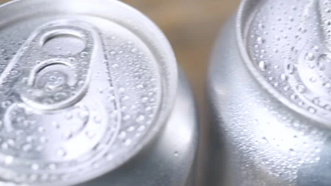 Top view water drop droplets on a few unmarked wet can of soda, cola or beer. Stock-Footage 142990719