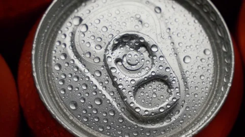 Top view water droplets on red can of soda or beer rotate background Stock Footage 106738256