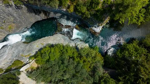 Top view of the waterfall with drone. Waterfall flowing in the forest Stock Photos