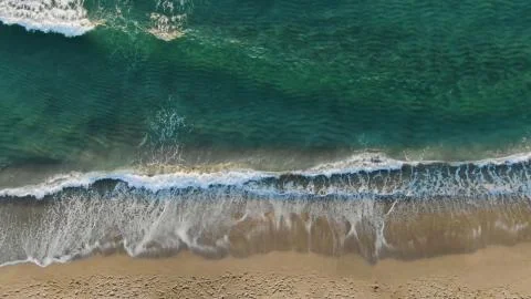 Top view of a wave with a crest on the beach Stock Photos