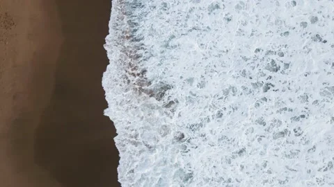 Top view of the waves arriving at the shore of the beach Stock Footage 157450301