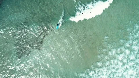 Top view of waves break on tropical white sand beach and surfer with surfing Video stock 103573925
