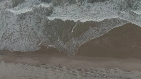 Top view of waves gently breaking on beach sand Stock Footage 223690054