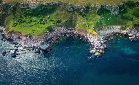 Top view of waves hitting the rocks at the beach. Beautiful aerial view of Be Stock Photos