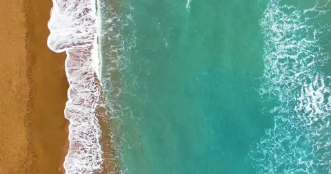 Top View of Waves Hitting on the Sandy Beach, 4k Resolution Stock Footage 149874216
