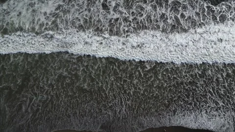 Top view of waves rolling onto the beach Stock Footage 266064174
