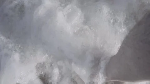 Top view of waves touching the feet on the sandy beach in HD Stock Footage 147473868