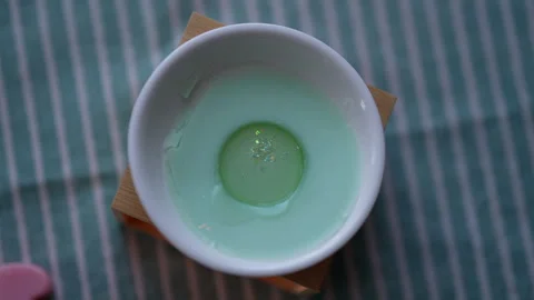 Top view of wax melts fusing in aromatherapy lamp diffuser to provide permanent Stock Footage 266315069