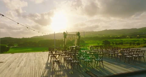 Top view of the wedding arch in a green field. Wedding ceremony with a decor on Stock Footage 198932899