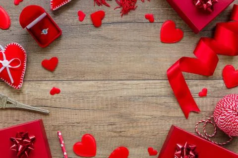 Top view wedding proposal concept. Romantic border arrangement with hearts, red Stock Photos
