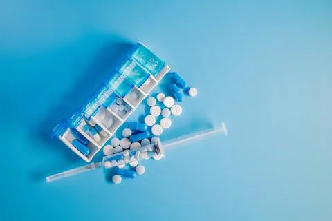 Top view of weekly pill box organizer, portable travel prescription or Stock Photos