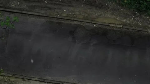Top view of a wet road after rain. Spring light rain, cars passing by outside th Stock Footage 276182959