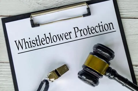 Top view of Whistleblower Protection text on white paper clipboard with gav.. Stock Photos