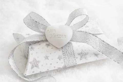 Top view of white and silver present box with white heart for christmas Stock Photos