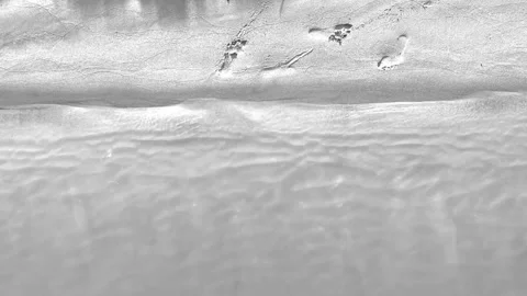 Top view of the white beach, slowly smooth moving Stock Footage 296283227