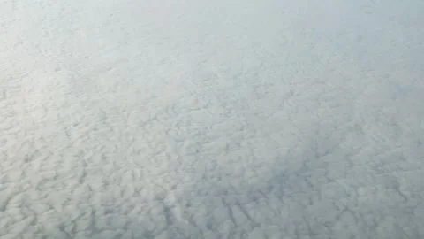 Top view of white clouds from the airplane porthole. Video stock 311954474