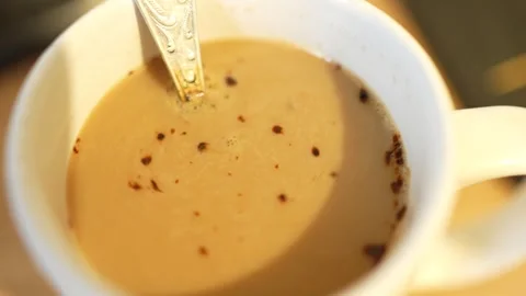 A top view of a white coffee cup filled with Stock Footage 327589650